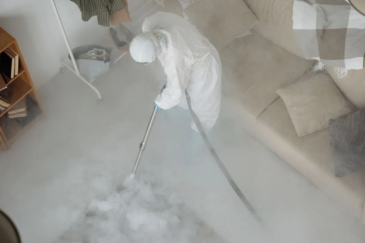 Biohazard cleanup technician in protective equipment, Greentree, NJ